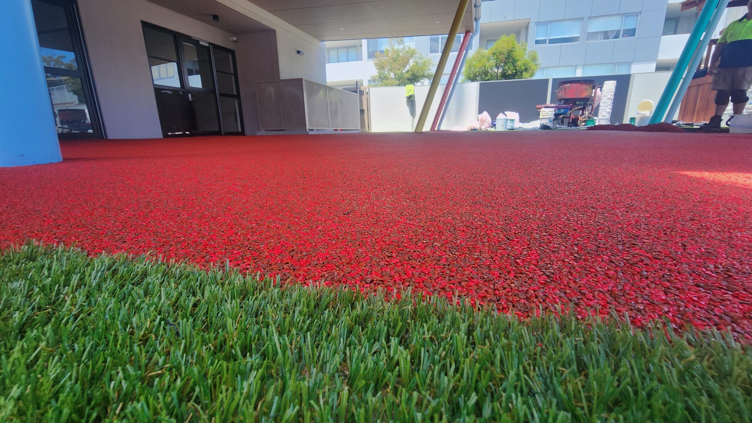 A variety of color options for synthetic grass by Impact Playgrounds, allowing for creative and personalised play area designs.
